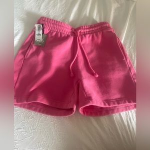 Aritzia new with tags- boyfriend sweat shorts in cosmo pink, size S